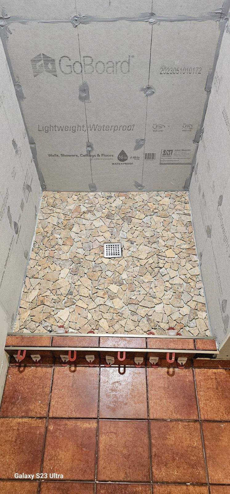 Pebble-stone shower floor